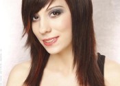A dark cherry red medium and layered hairstyle
