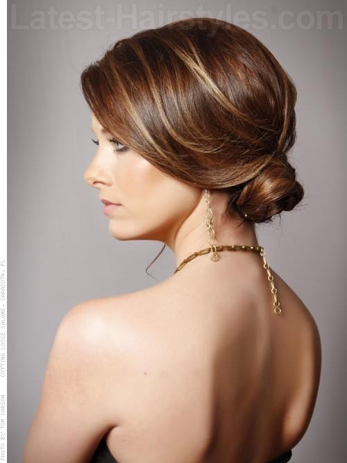 sophisticated low bun highlighted style side view 