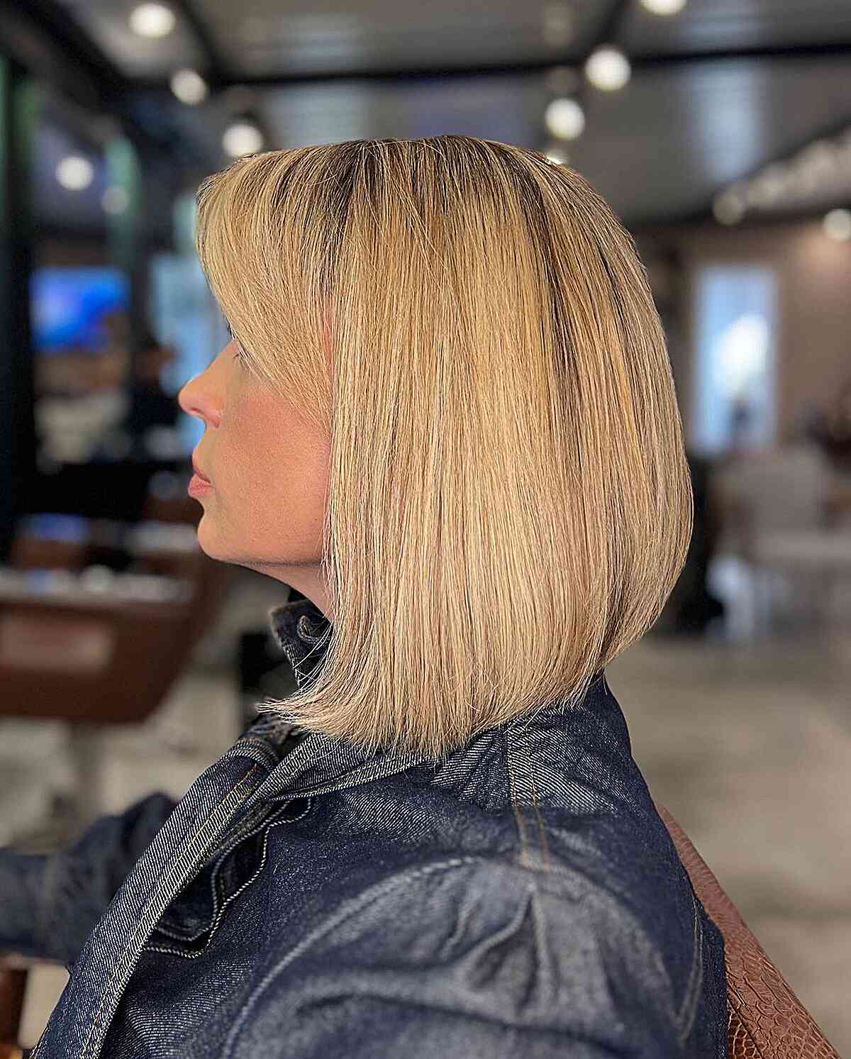 90s-inspired Blonde Lob with Graduated Layers and Bangs