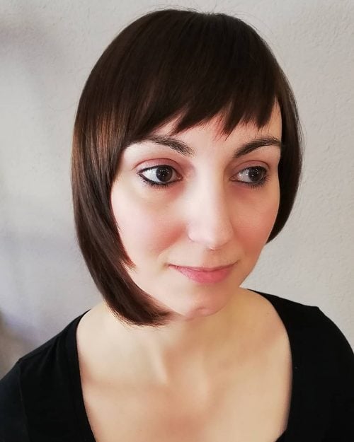 Asymmetrical bangs on short hair
