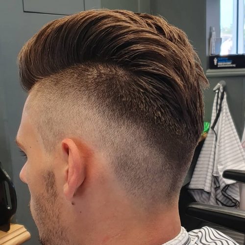 A imitation hawk fade is a type of fade that complements a imitation hawk hairstyle yesteryear adding contra xv Lit Faux Hawk Fade Haircuts for Guys