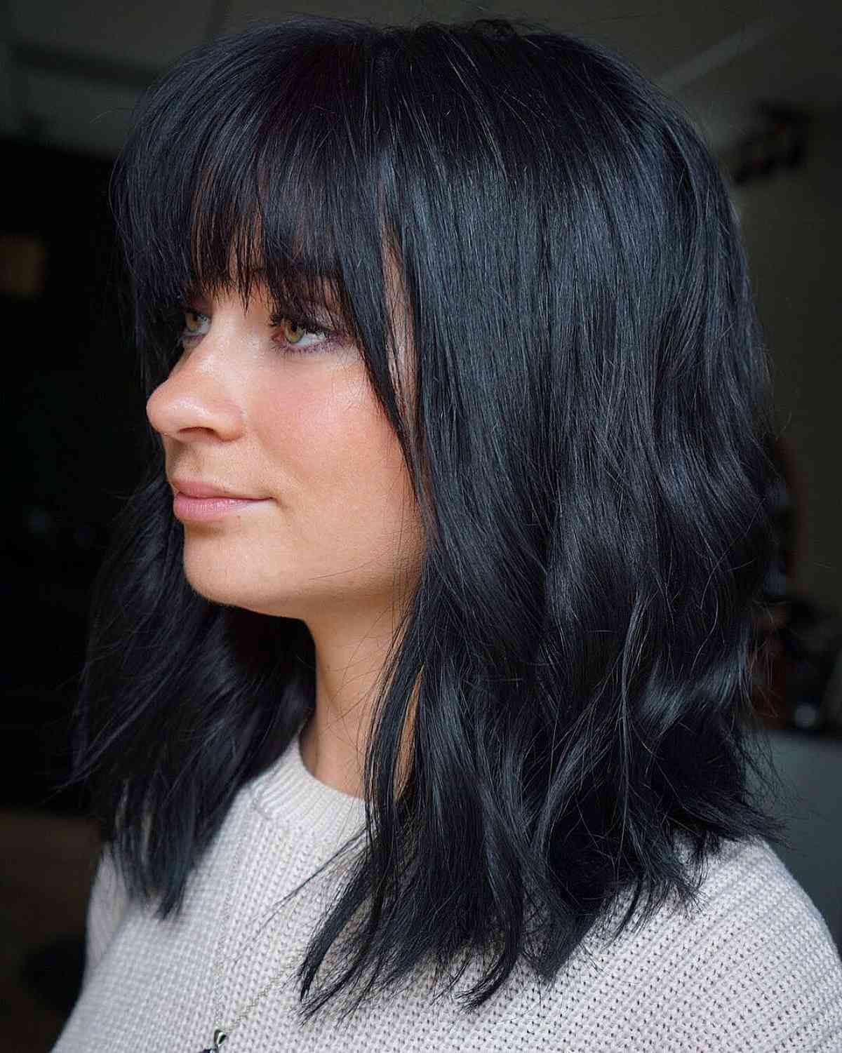 Messy bangs and layers shoulder-length