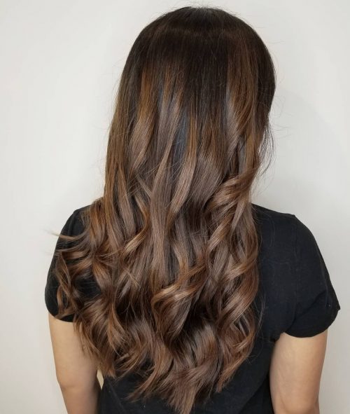 Picture of a beautiful long loose curls on caramel brown