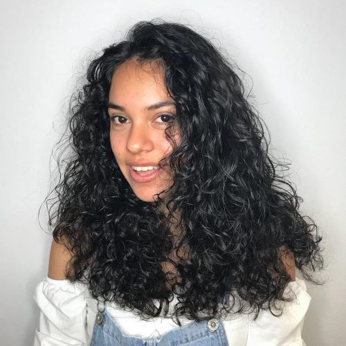 With texture at the forefront of pilus fashion these days 23 Cutest Long Curly Hairstyles