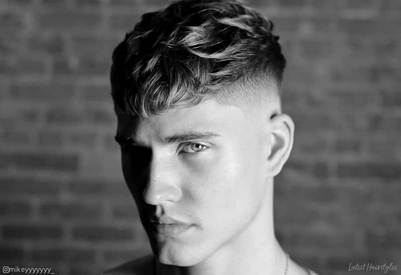 Image of a man with a long Caesar haircut