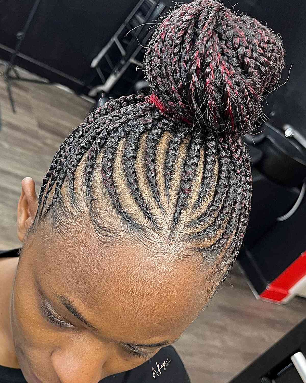 Black Braided Bun with Subtle Red Highlights