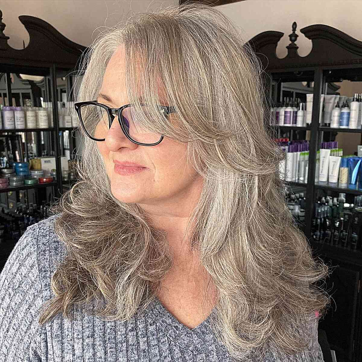 Long-Length Blended Grey Hair with Swoopy Layers for 60-year-olds with Glasses