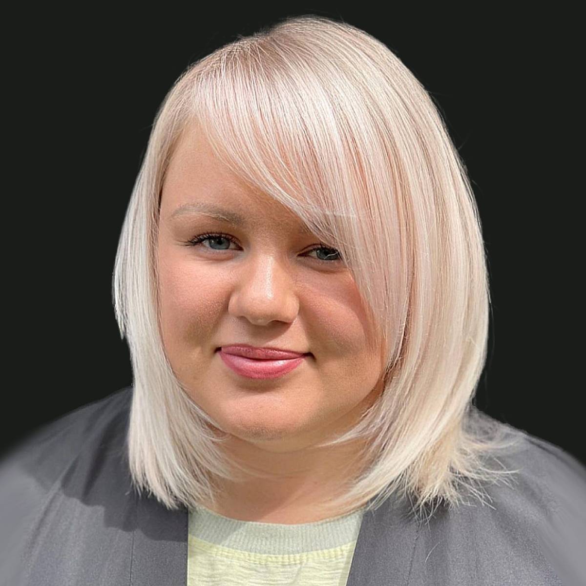 Image of Blunt bob haircut with a round face on a woman with medium-length hair