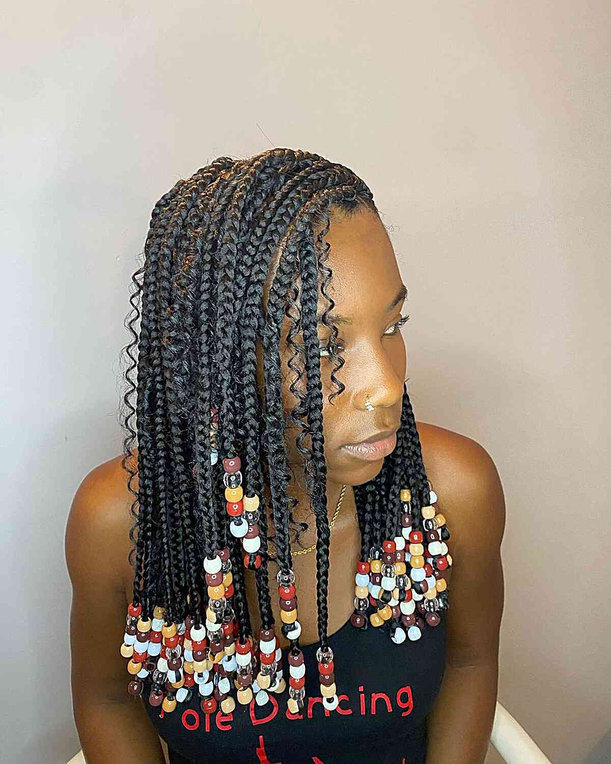 Mid-Length Bohemian Knotless Braids with Colorful Beads