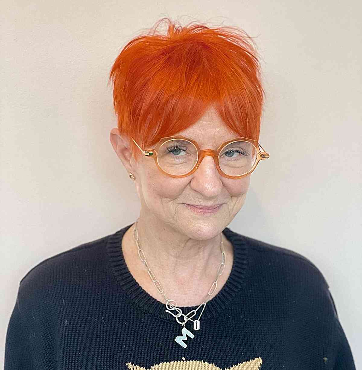 Bright Orange Pixie with Curtain Bangs for Ladies Aged 50 and Up