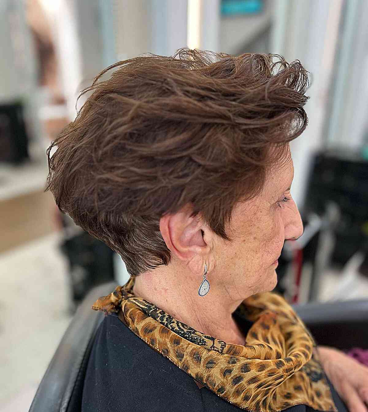 Brunette Pixie with Messy Layers for grandmas over 60 with thick hair