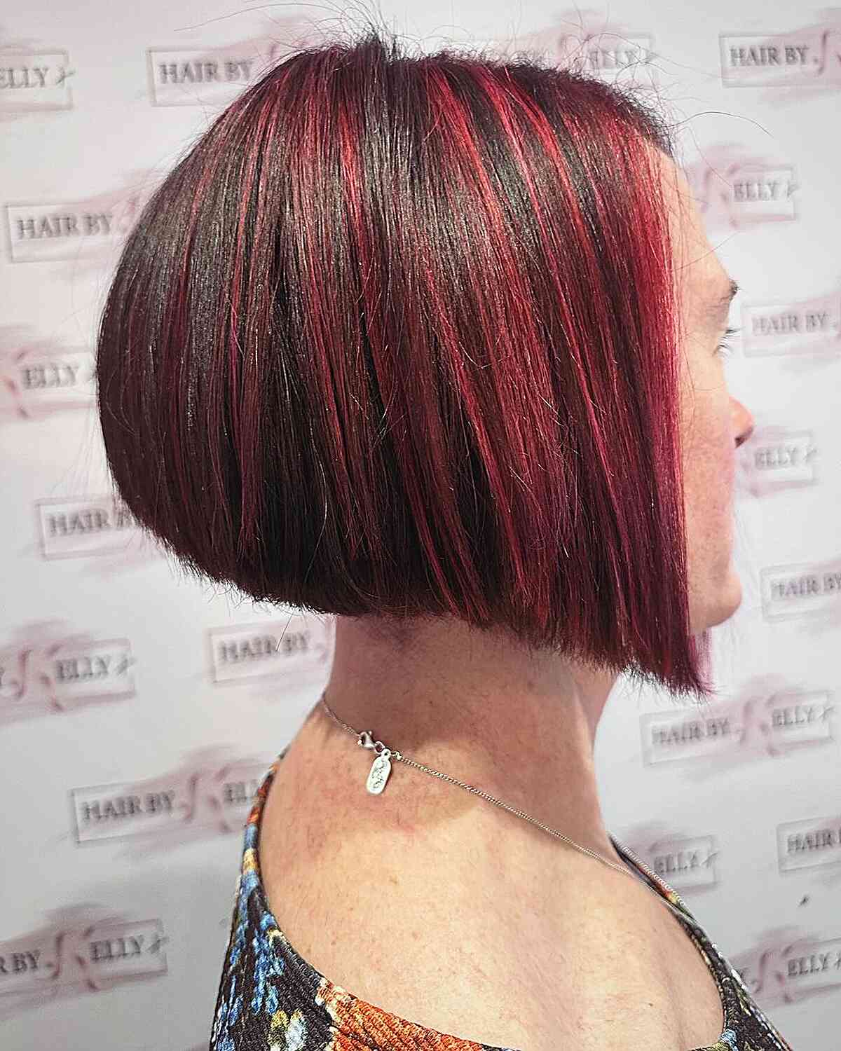 Chin-Length Angled Stacked Wedge Bob with Red Highlights