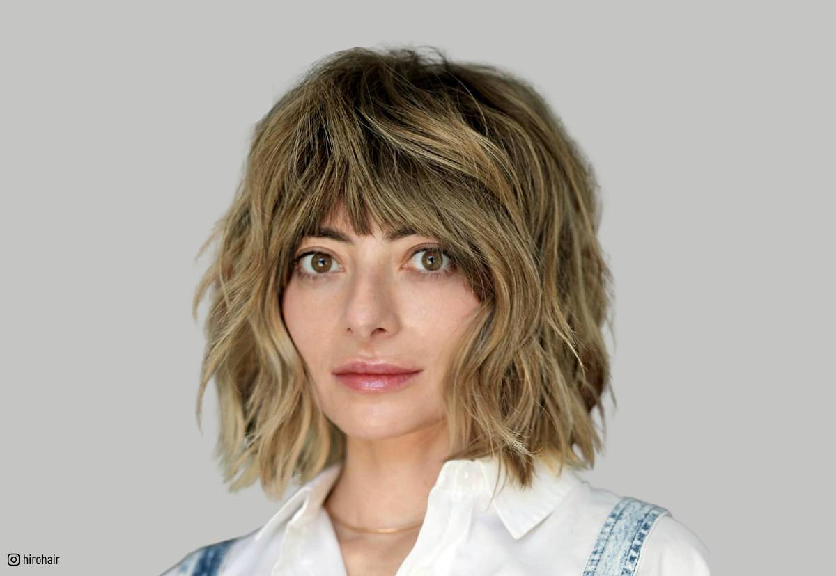 Image of Short shaggy haircut with layered texture and wavy finish