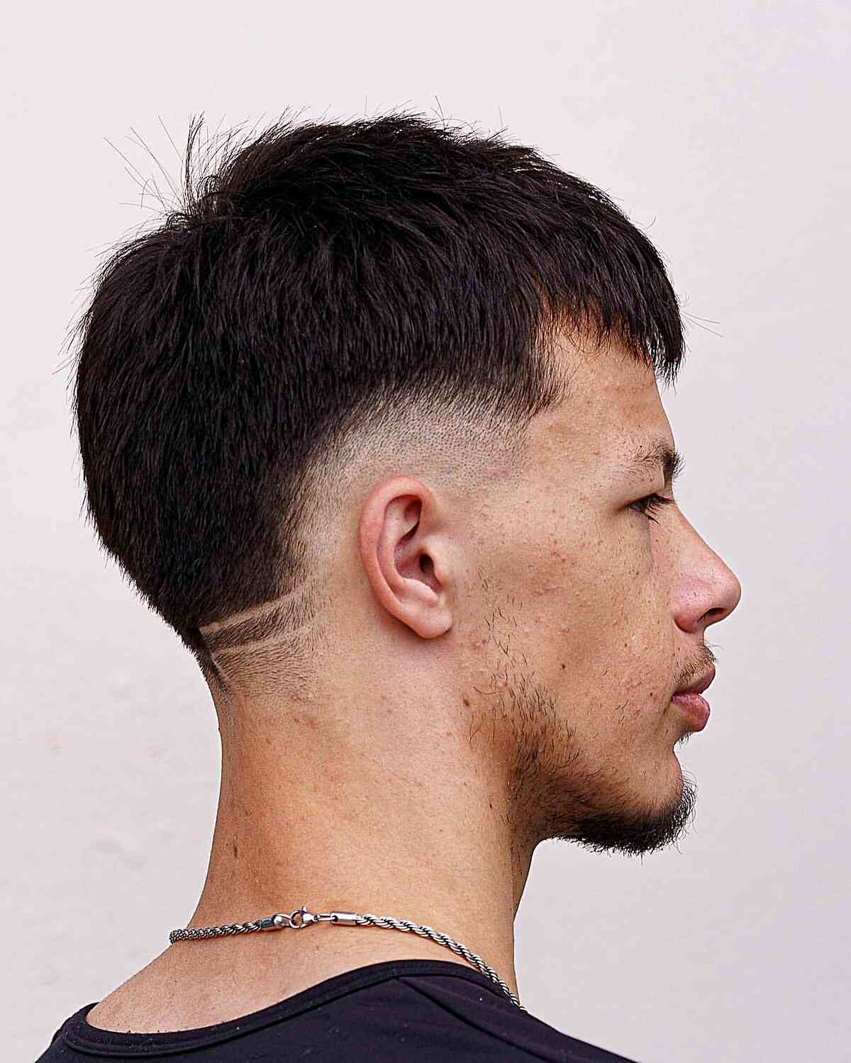 Choppy Straight Hair with Low Burst Skin Fade for Men
