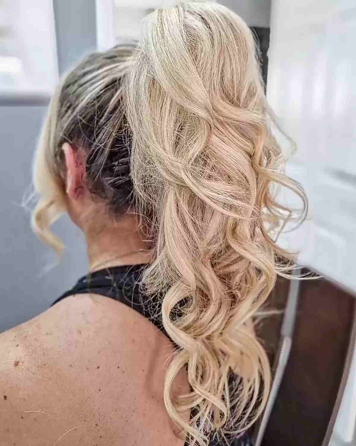 Longer Curly Blonde Ponytail with Dark Roots