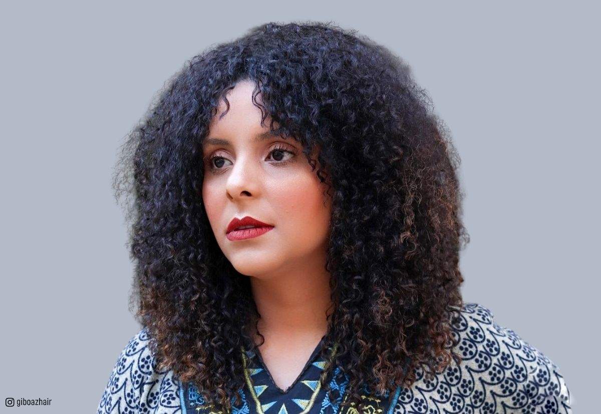21 Best Ways to Get Curtain Bangs for Curly Hair Right Now 21 Best Ways to Get Curtain Bangs for Curly Hair Right Now
