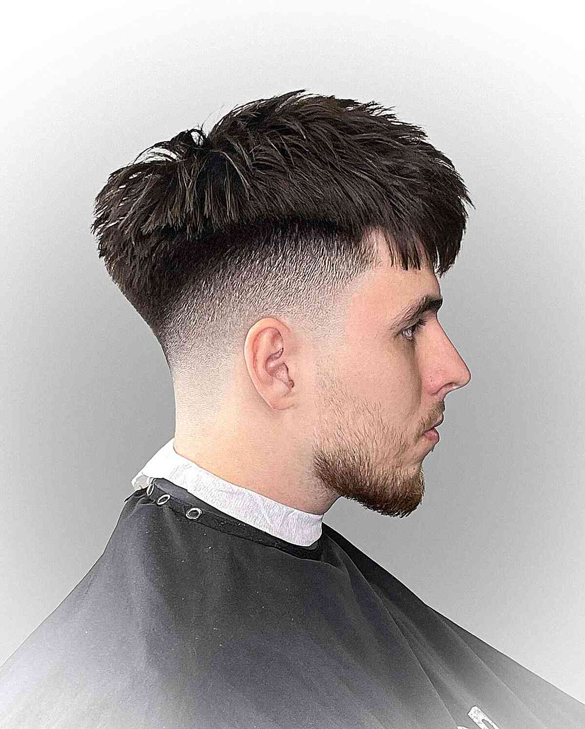 Dapper Fade Cut with Textured Bangs for Men
