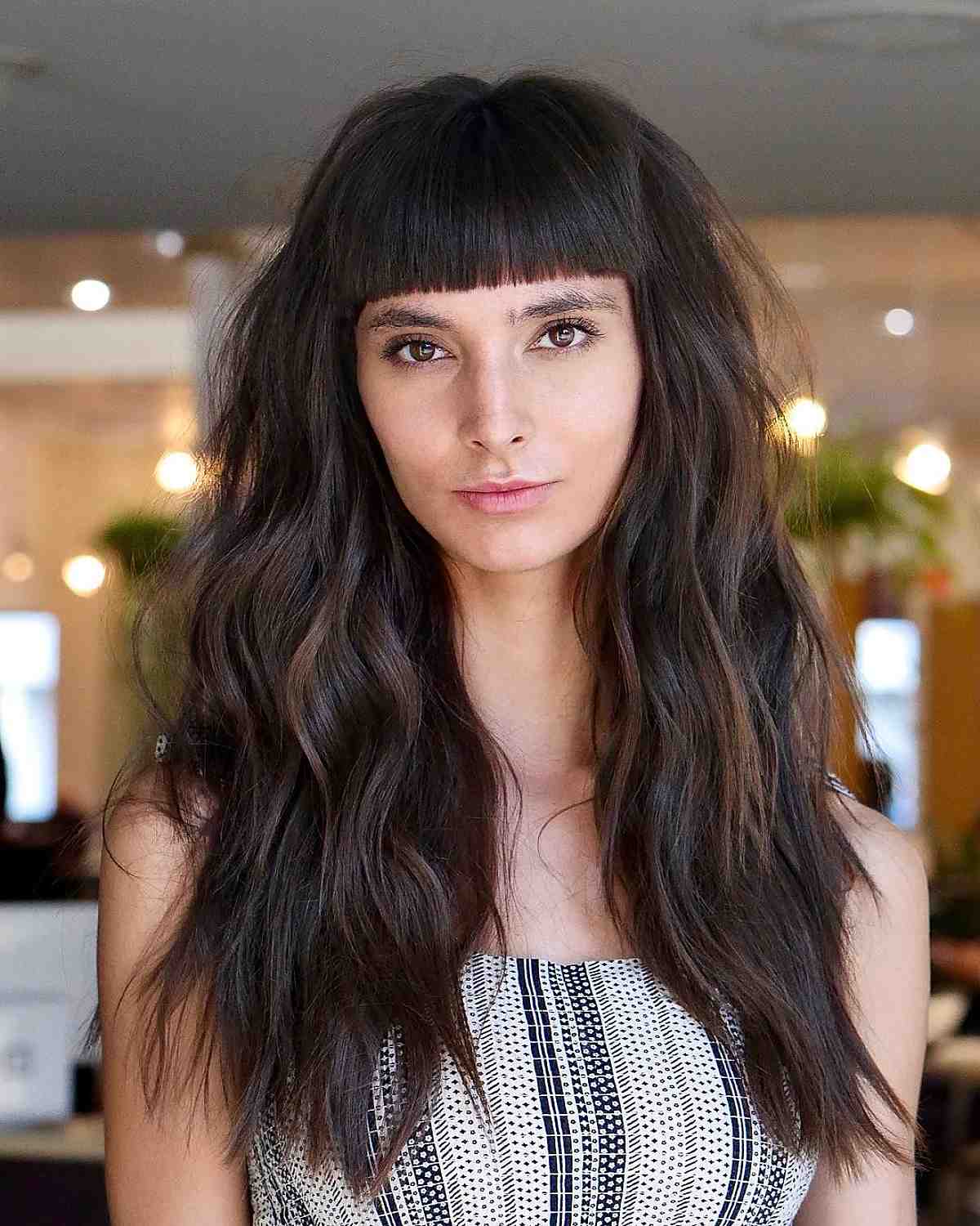 Mature dark long hair with blunt bangs