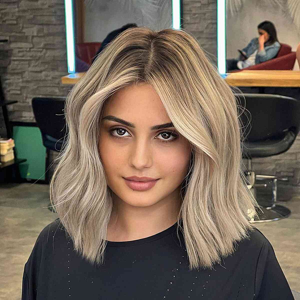 Dark Rooted Blunt Shoulder-Length Cut for women with blonde highlights