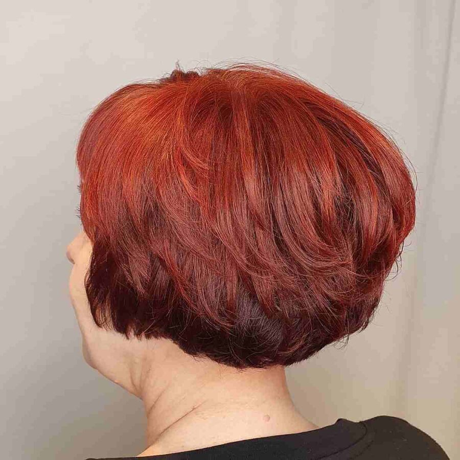Ear-Length Layered Bob on Bright Red Hair