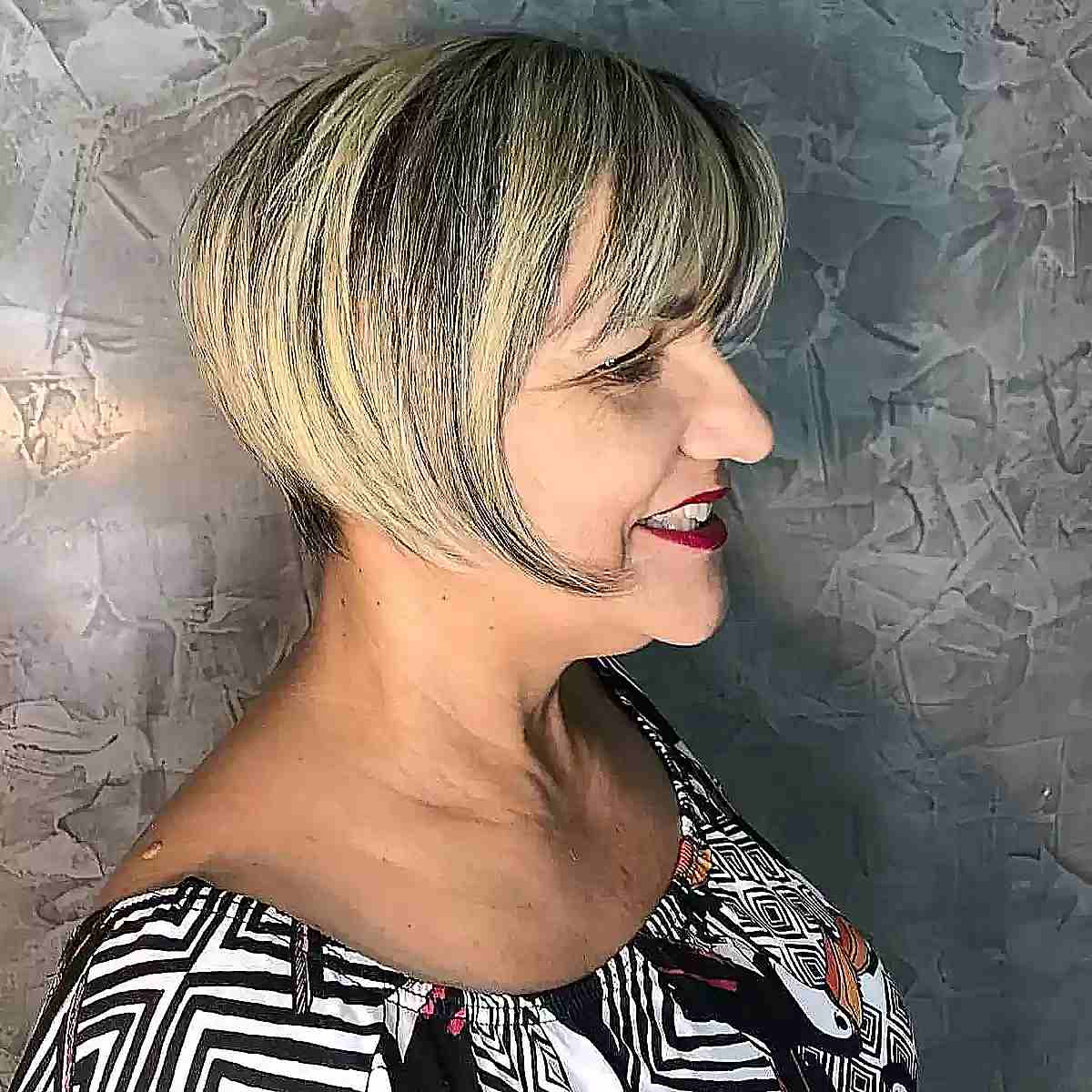 Edgy Bixie with Chunky Blonde Highlights and Bangs for Women Aged Seventy