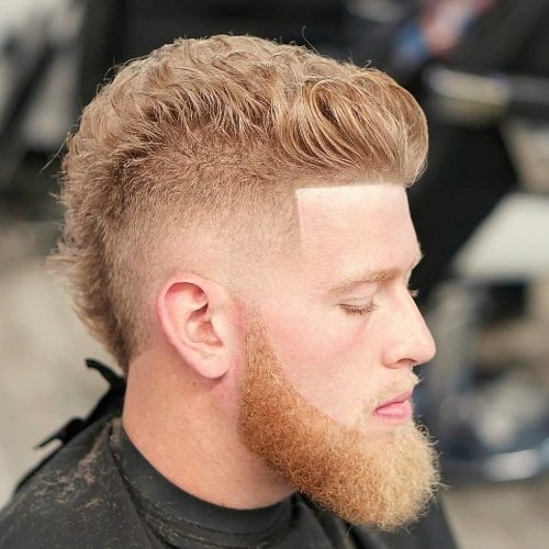 A imitation hawk fade is a type of fade that complements a imitation hawk hairstyle yesteryear adding contra xv Lit Faux Hawk Fade Haircuts for Guys