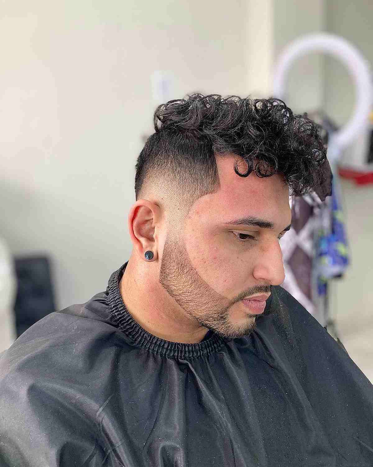 Faded Voluminous Curls with a Beard Lineup for Men