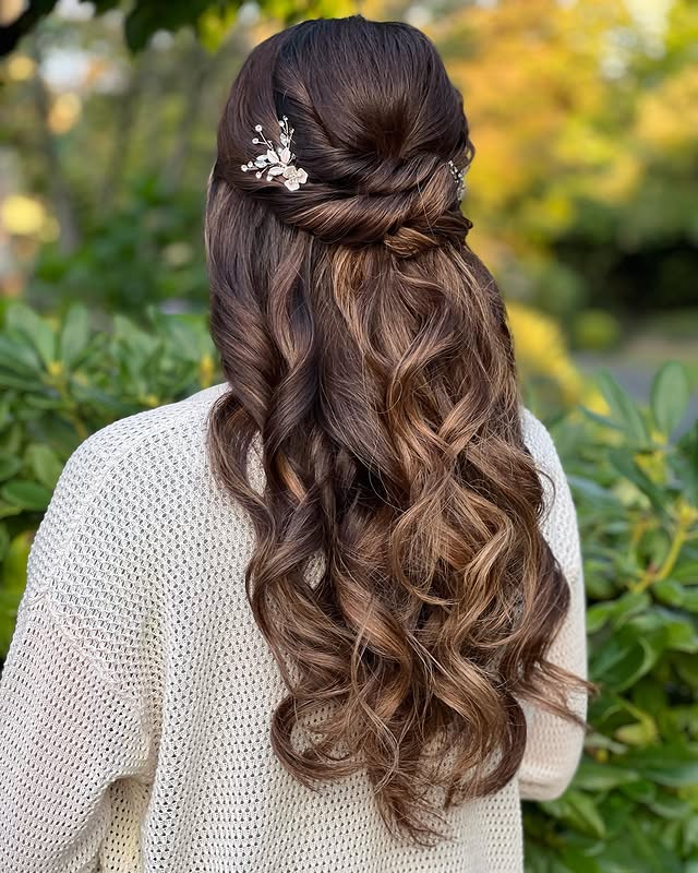 Chic Half-Up Half-Down Loose Waves with Floral Detail