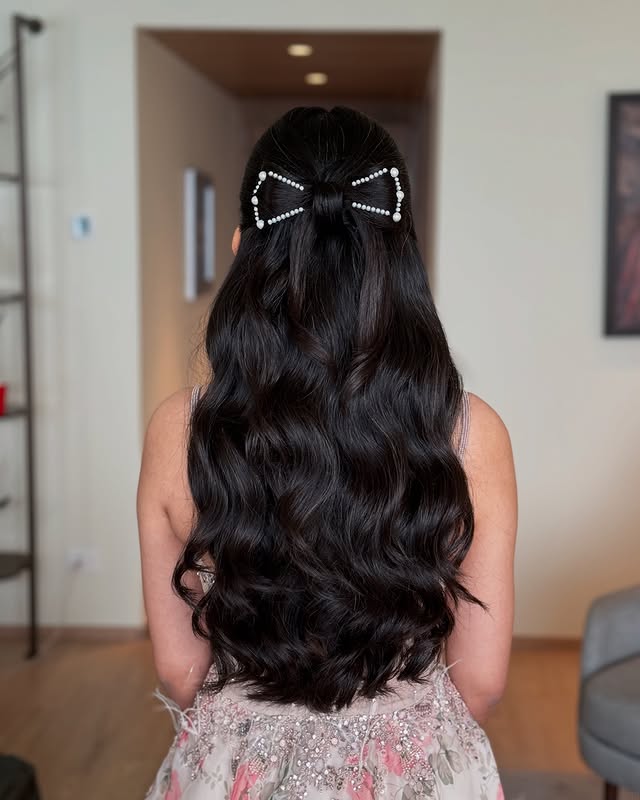 Elegant Half-Up Half-Down Waves with Pearl Bow Accent