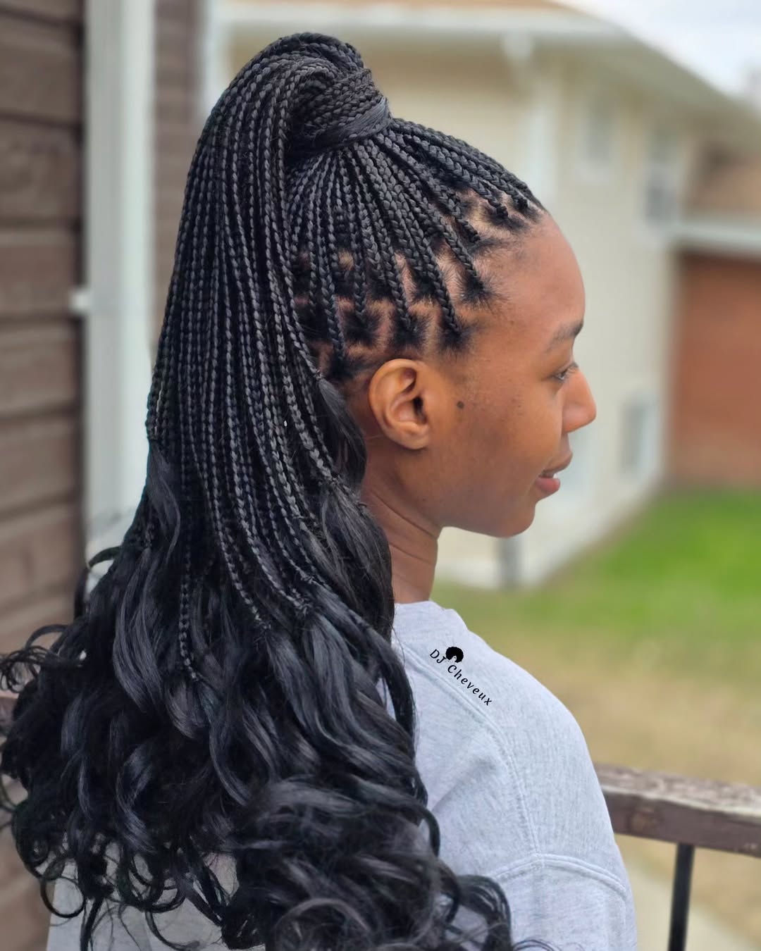 Elegant High Ponytail Knotless Box Braids with Loose Waves