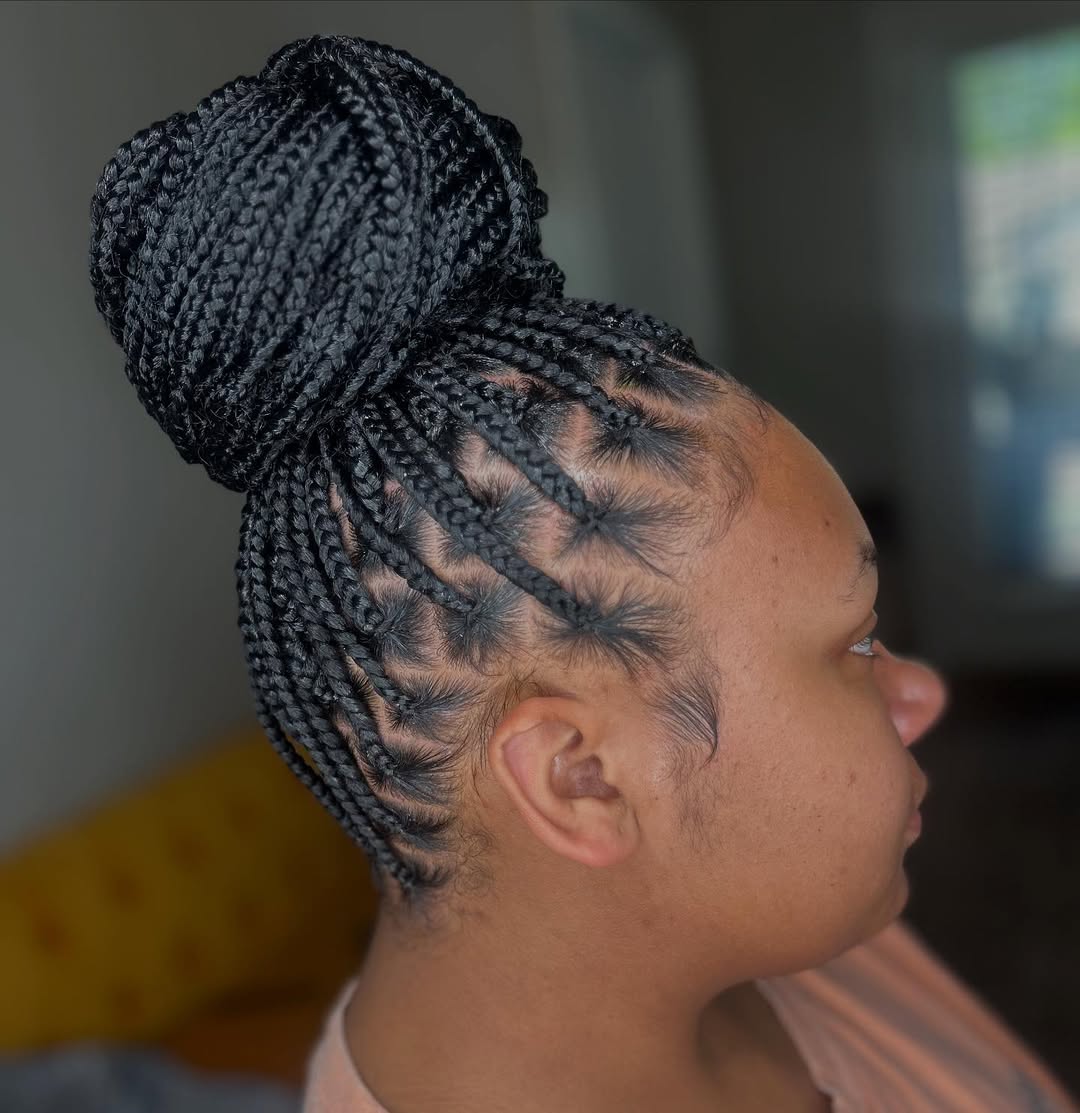 High Bun Knotless Box Braids with Intricate Parting