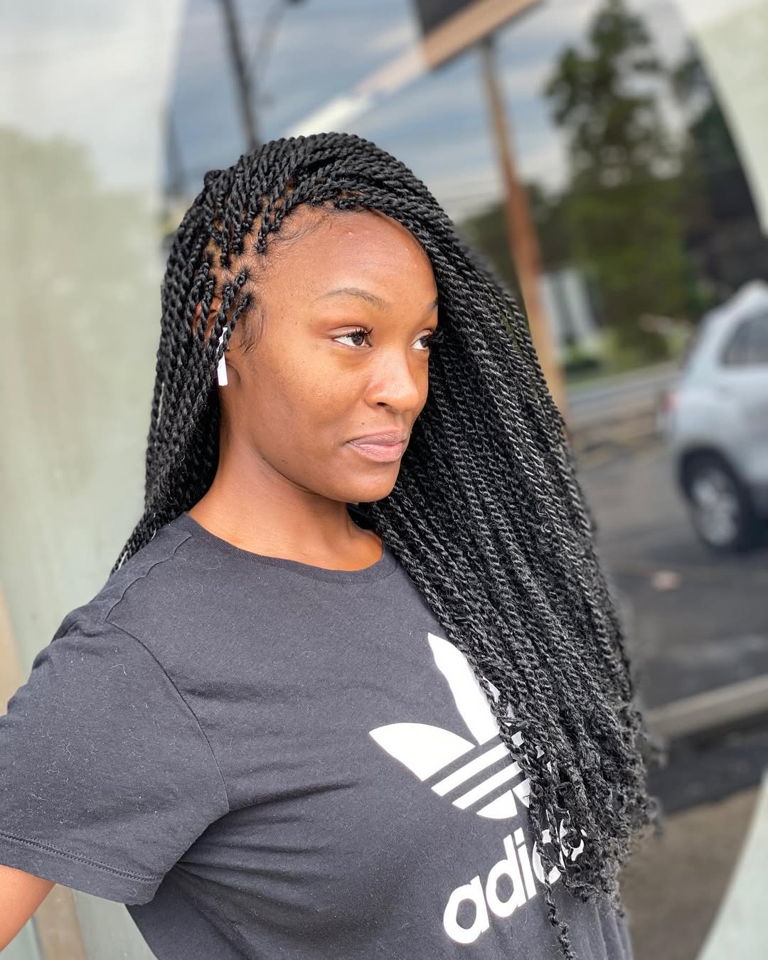 Long and Sleek Senegalese Twists with Unique Side Part