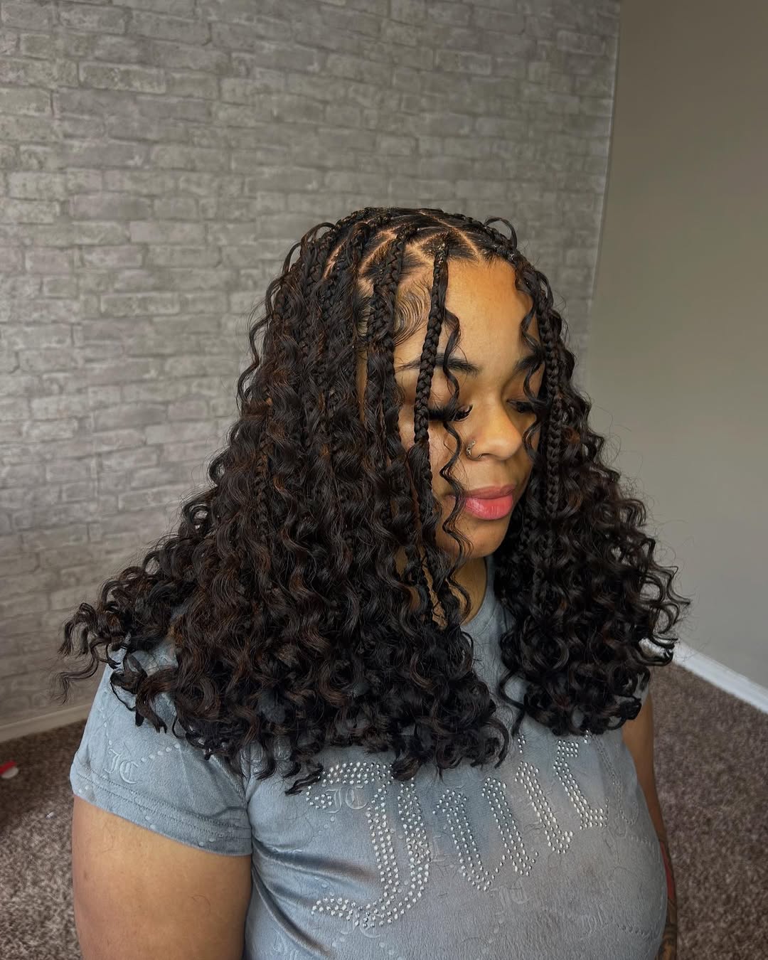 Voluminous Knotless Box Braids with Playful Curls
