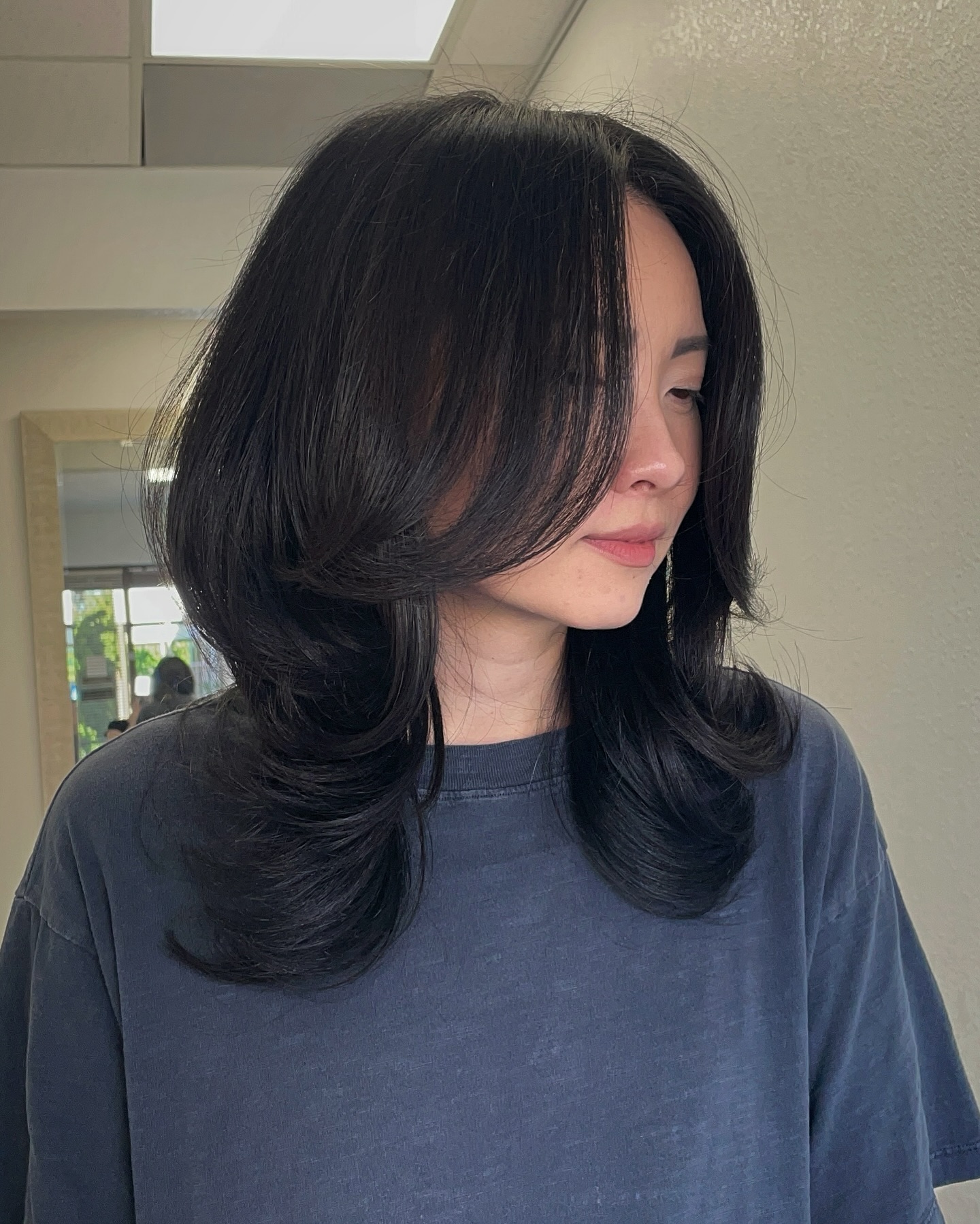 Sleek Layered Hush Cut with Soft Volume