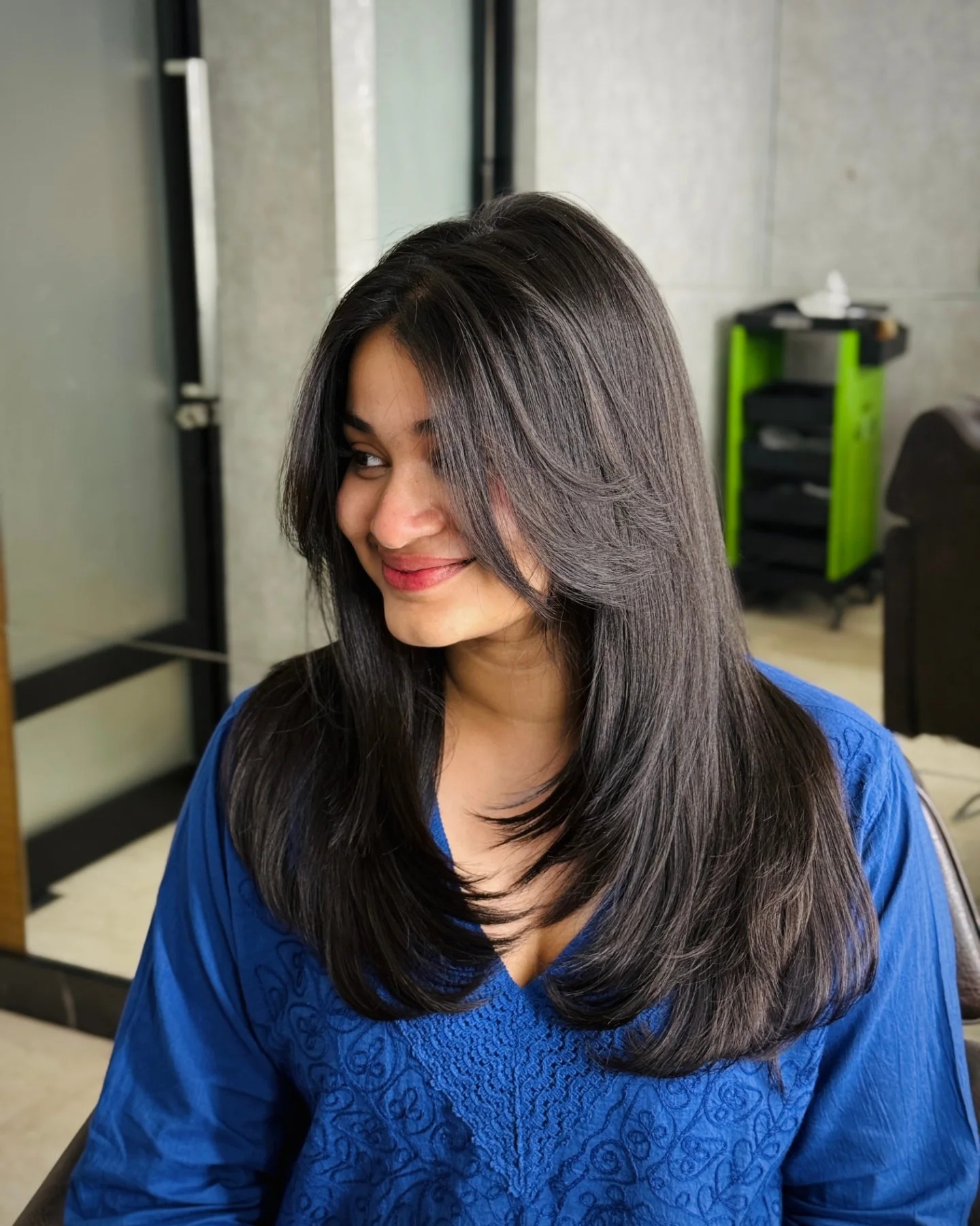 Sleek Feathered Layers with Subtle Face-Framing Strands