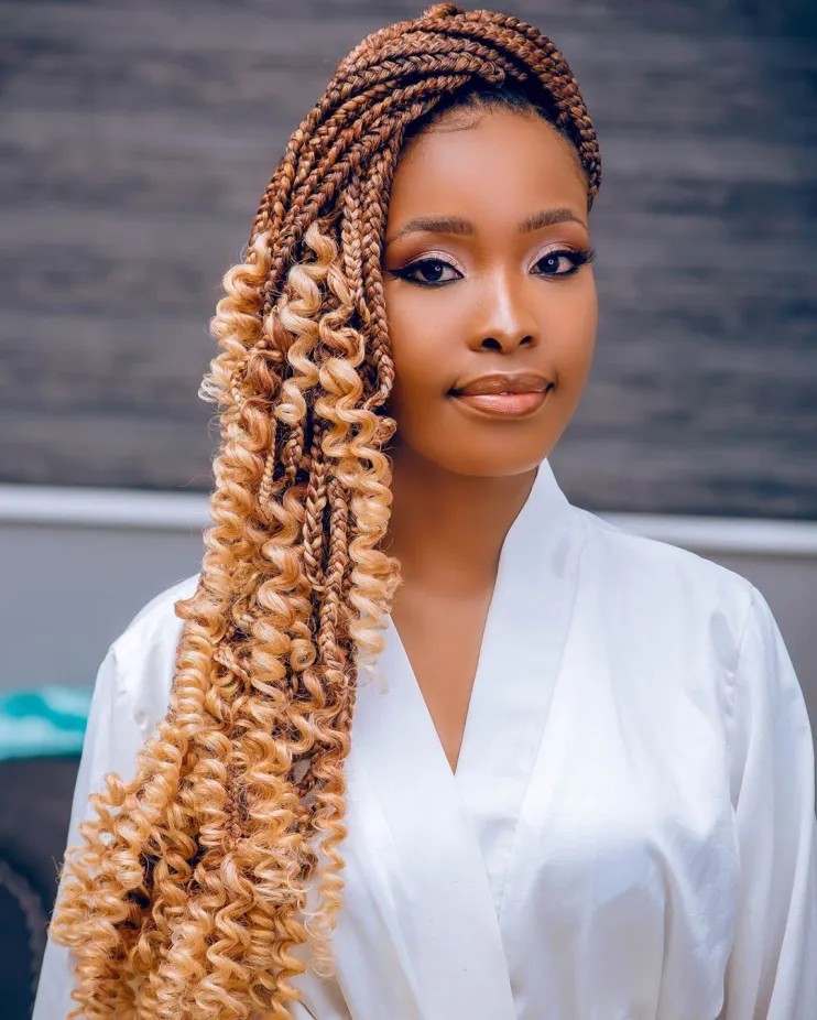 Dynamic Blonde Box Braids with Spiraled Ends