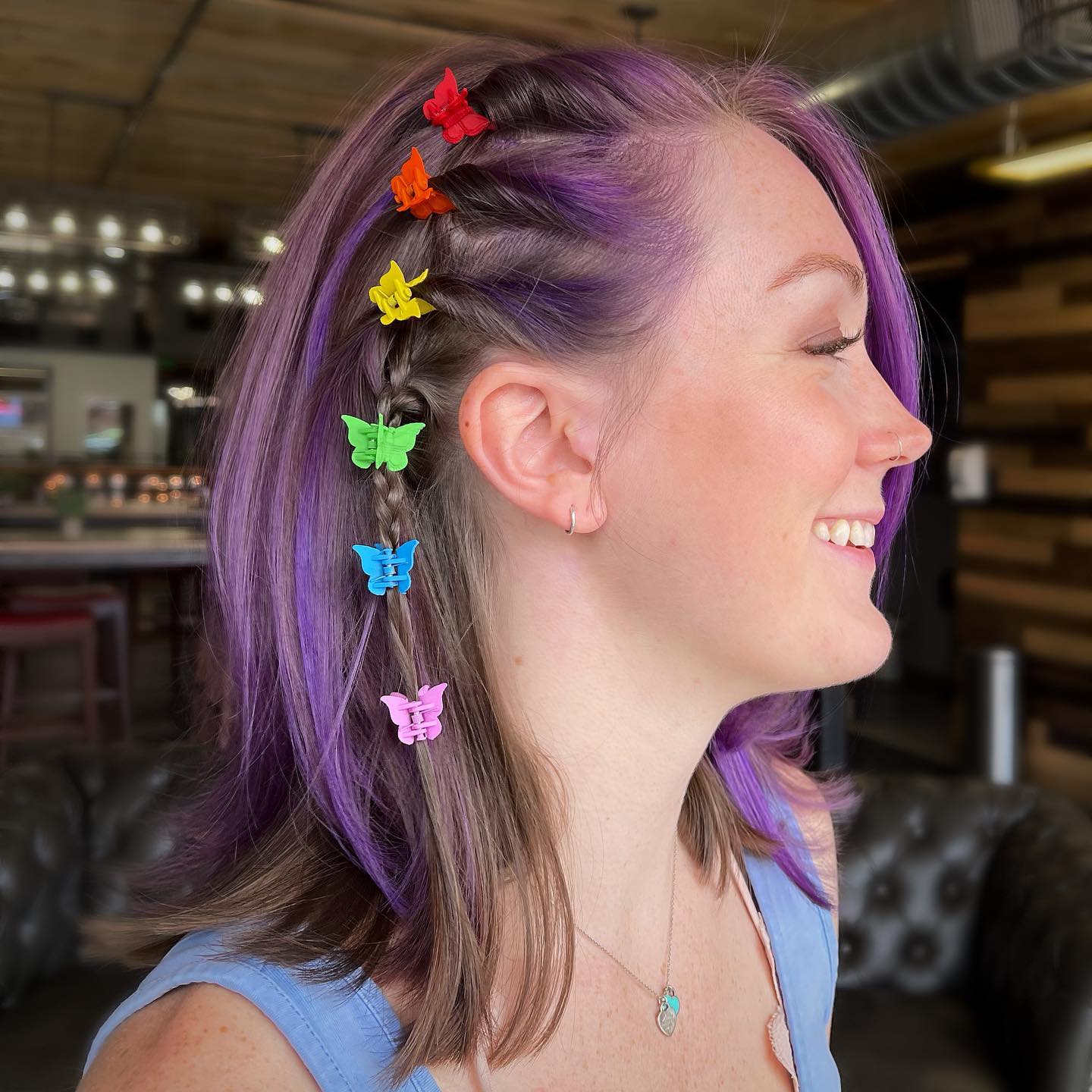 Vibrant Purple Layered Cut with Playful Butterfly Clips