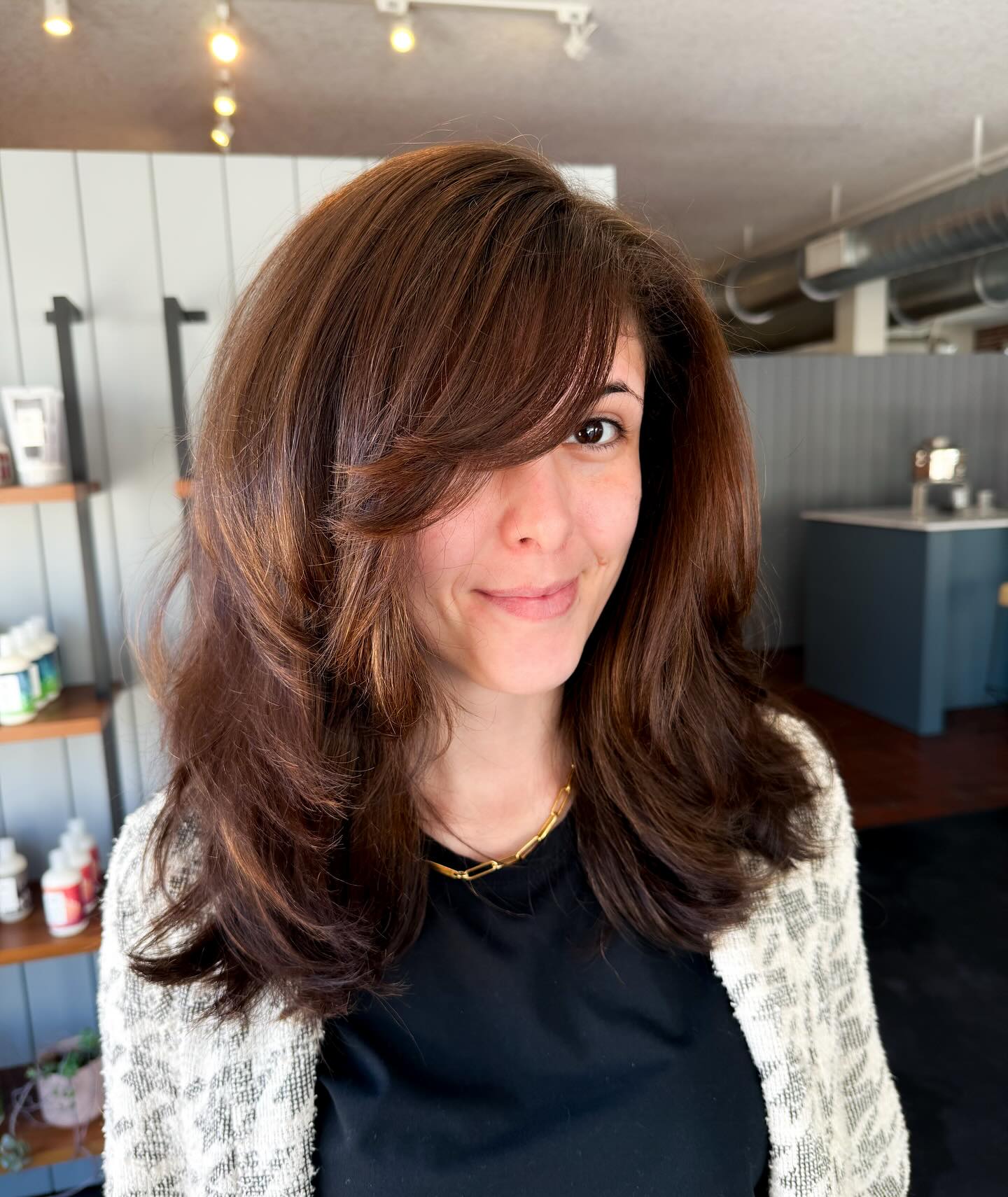 Voluminous Layered Cut with Face-Framing Bangs
