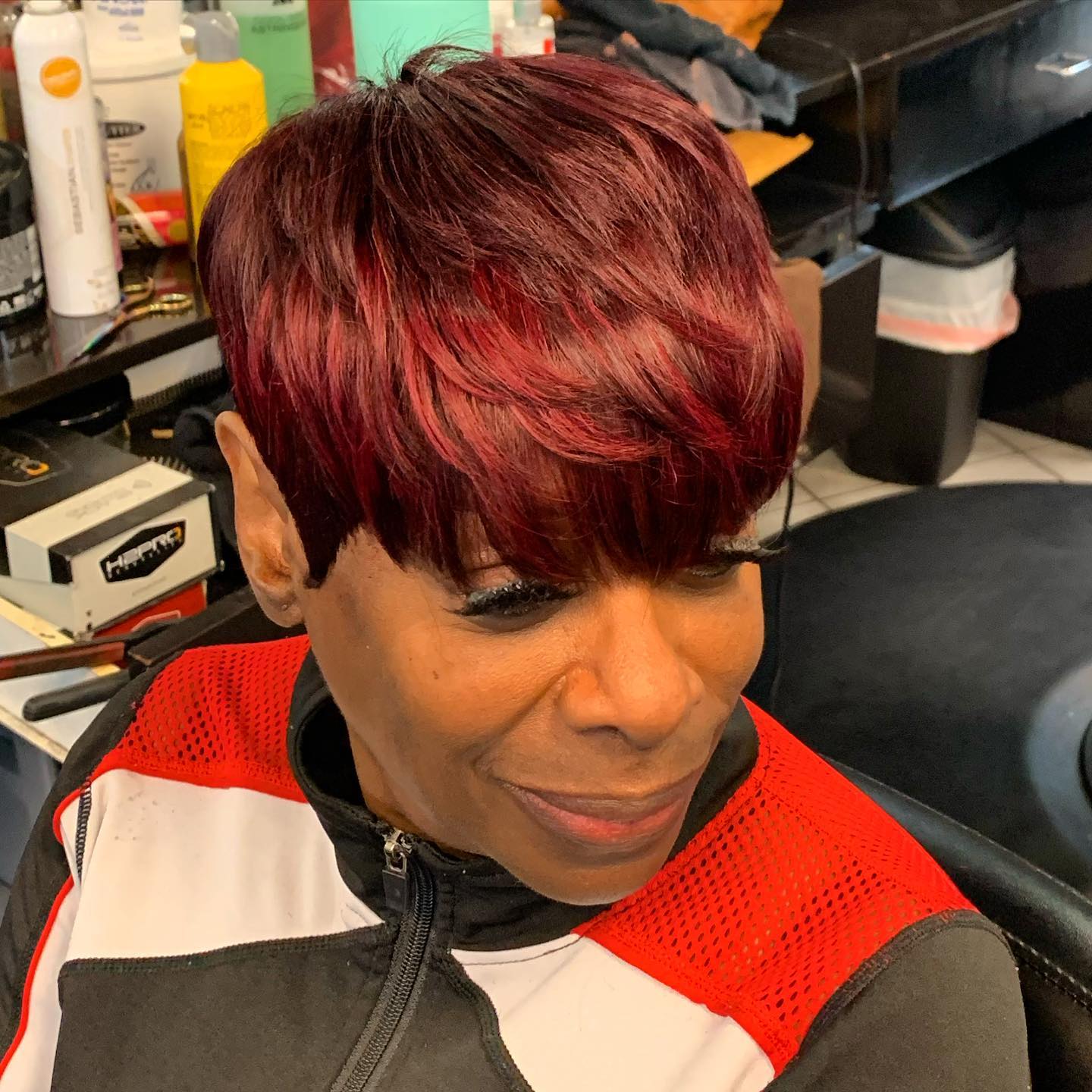 Bold Textured Pixie with Vibrant Red Highlights