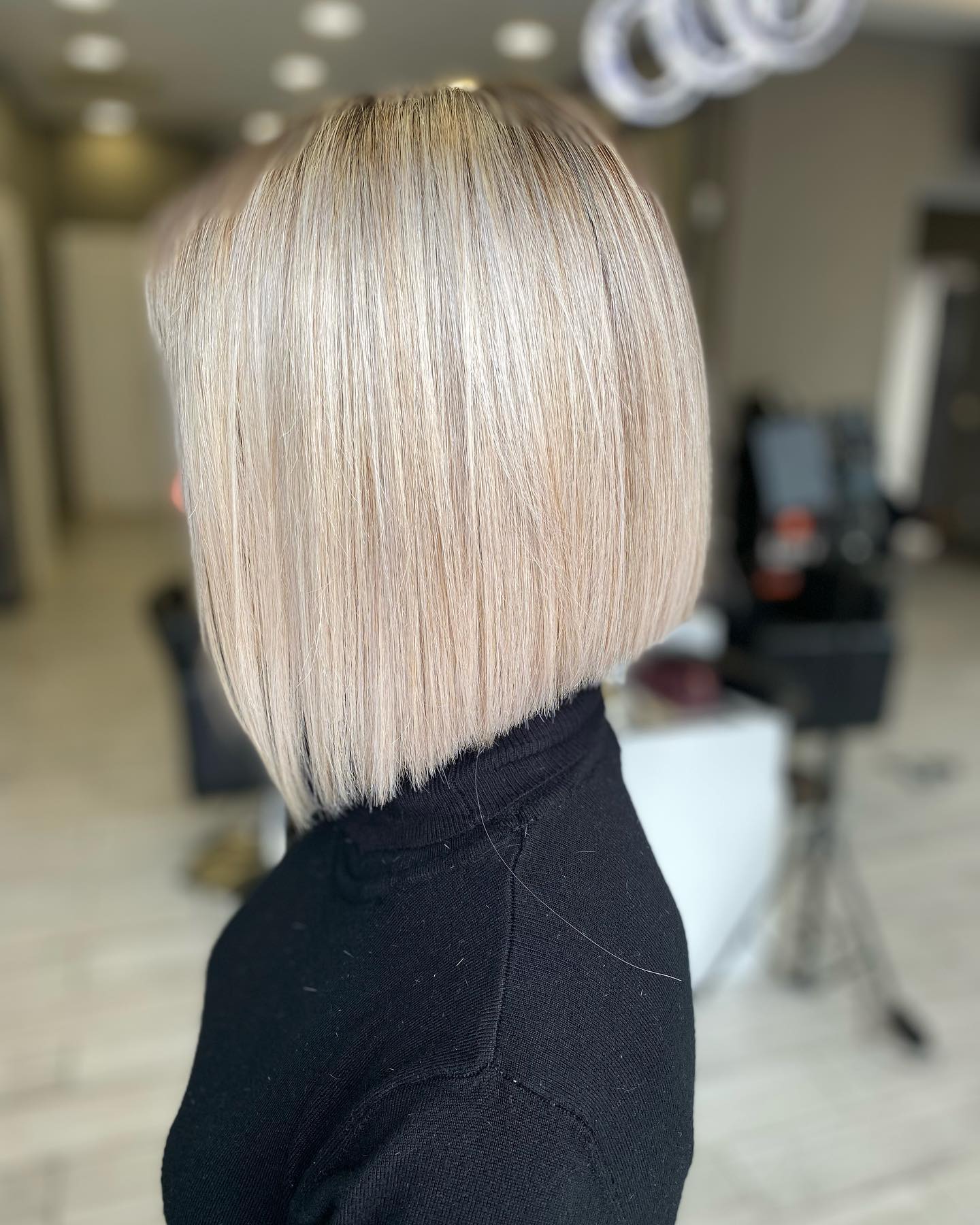 Chic Light Blonde Angular Bob with Sleek Finish