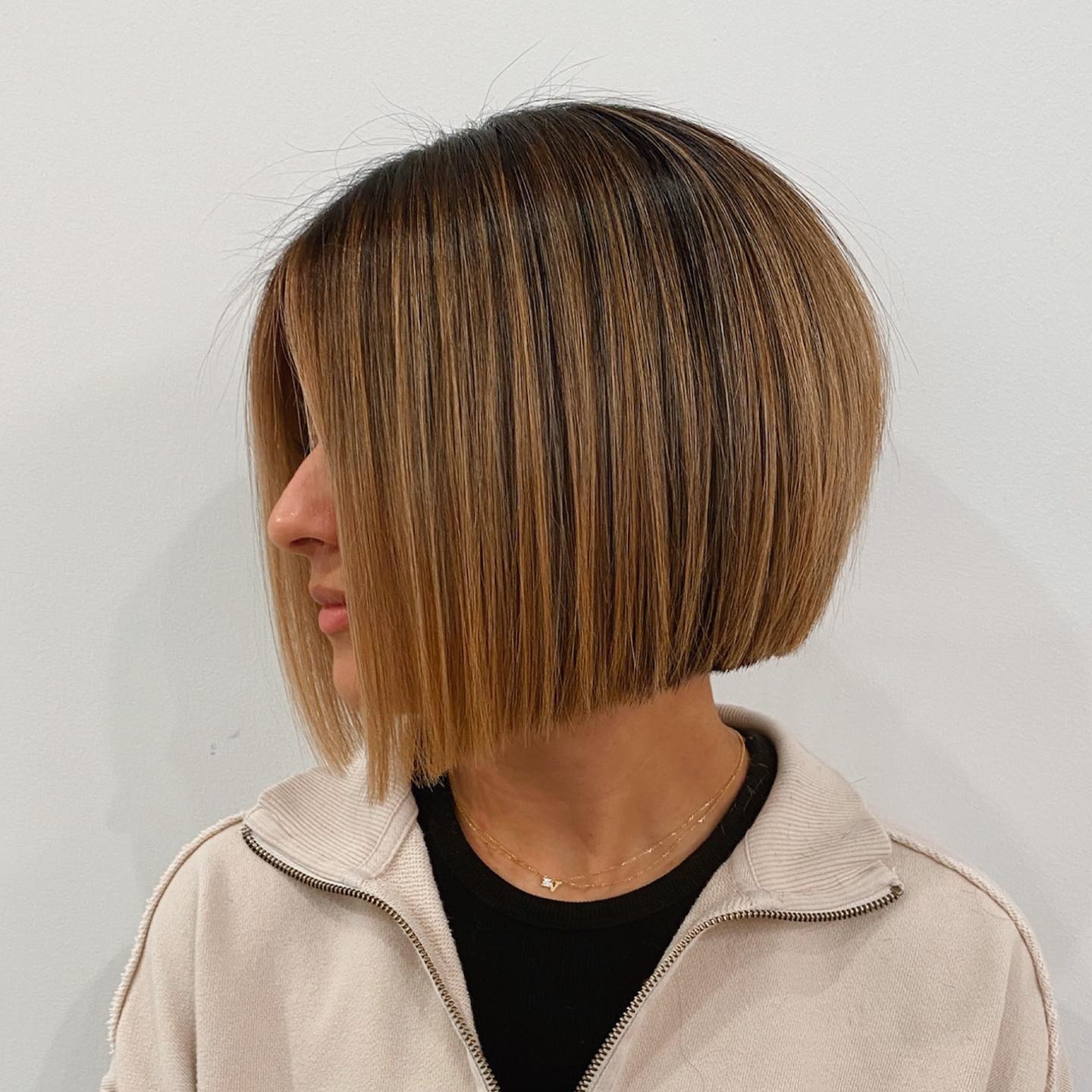 Chic Textured Angular Bob with Warm Balayage