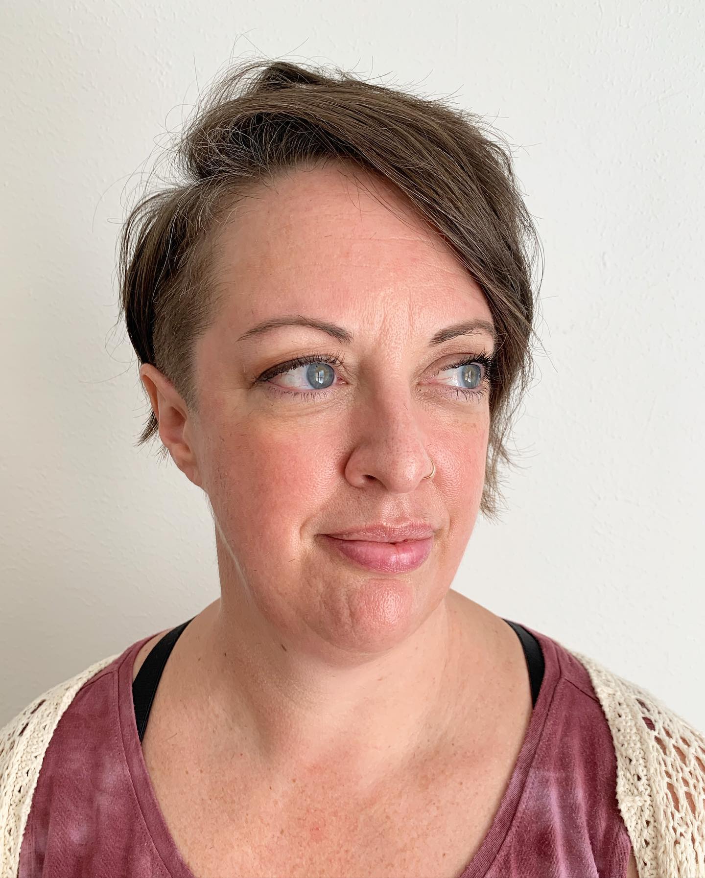 Modern Short Side-Swept Cut with Textured Layers