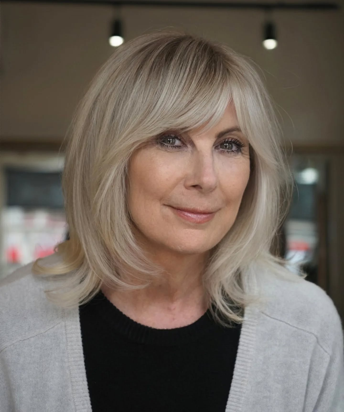 Soft Layered Blonde Cut with Face-Framing Bangs