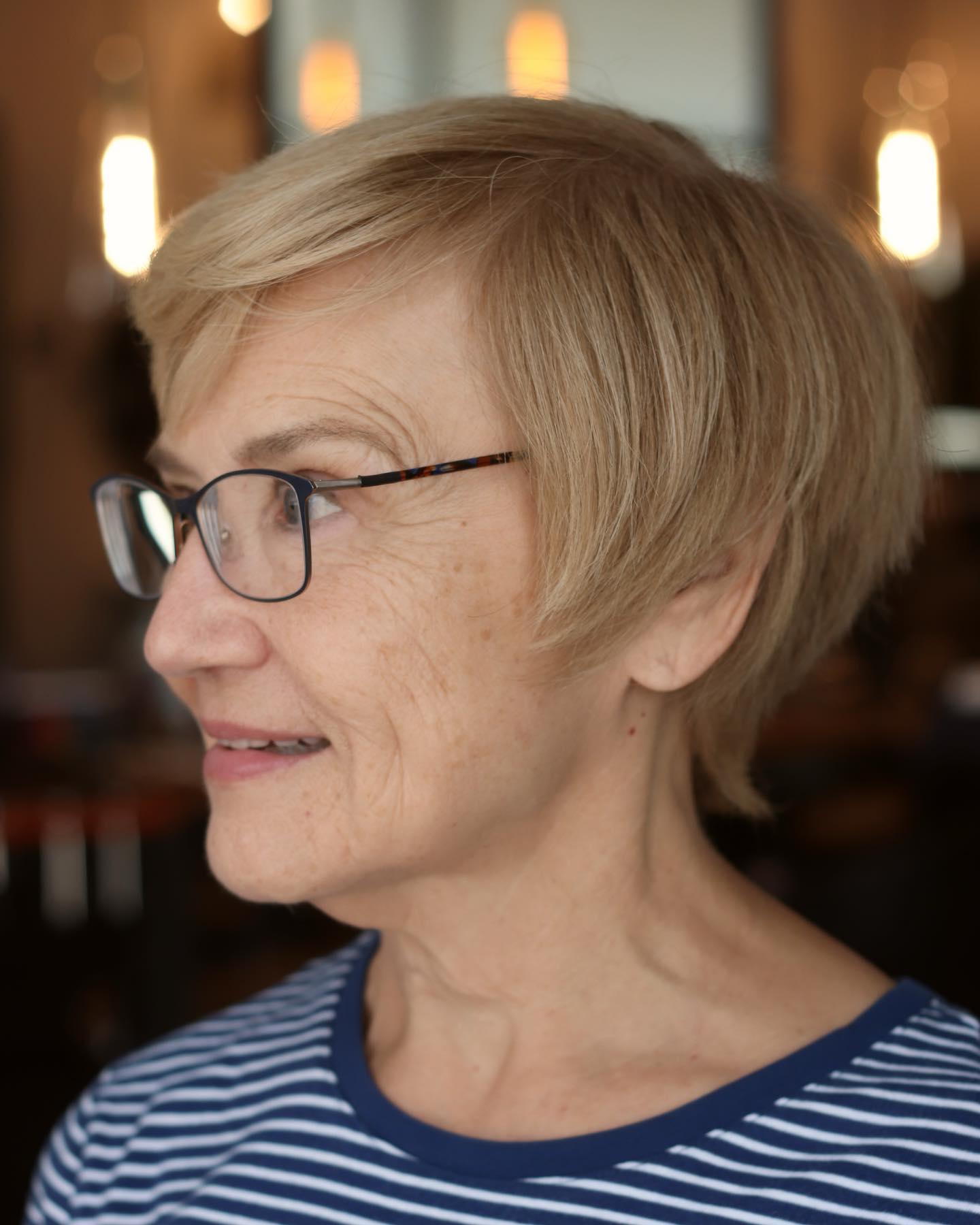 Soft Textured Blonde Pixie with Side-Swept Bangs