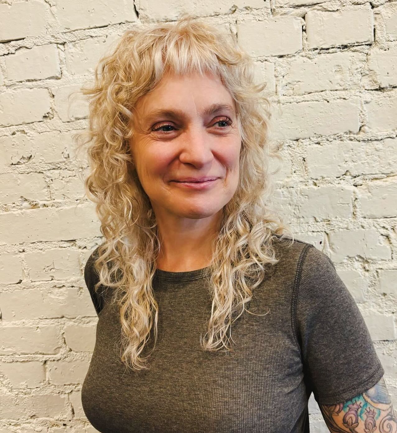 Textured Curly Cut with Playful Choppy Bangs