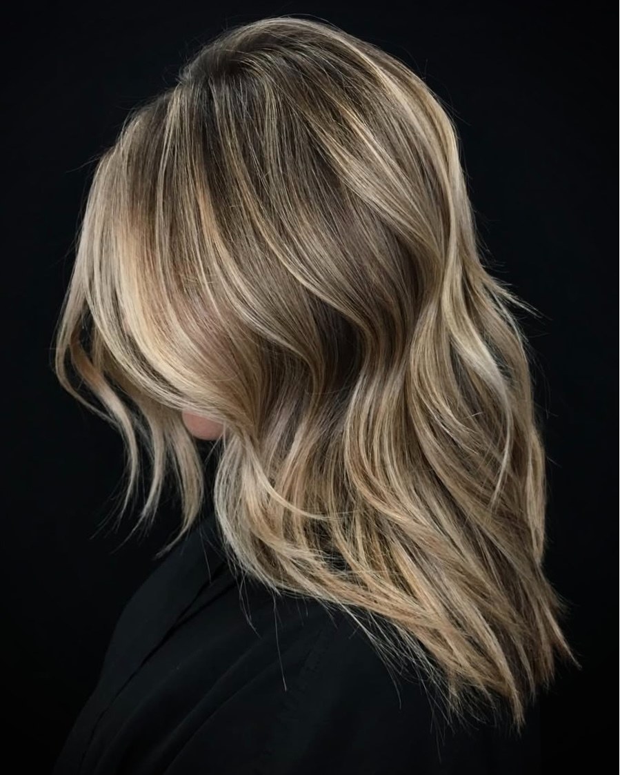 Textured Long Layers with Sun-Kissed Blonde Highlights