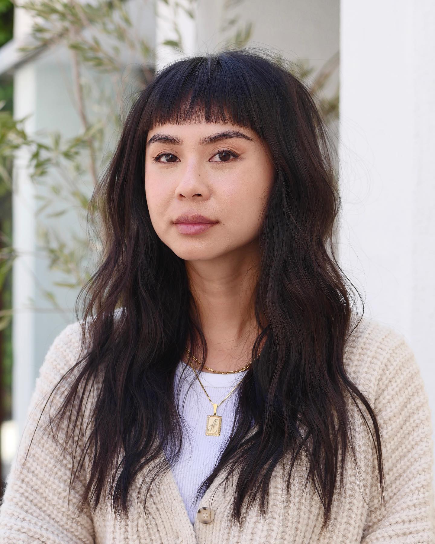 Chic Textured Long Cut with Bold Straight Bangs