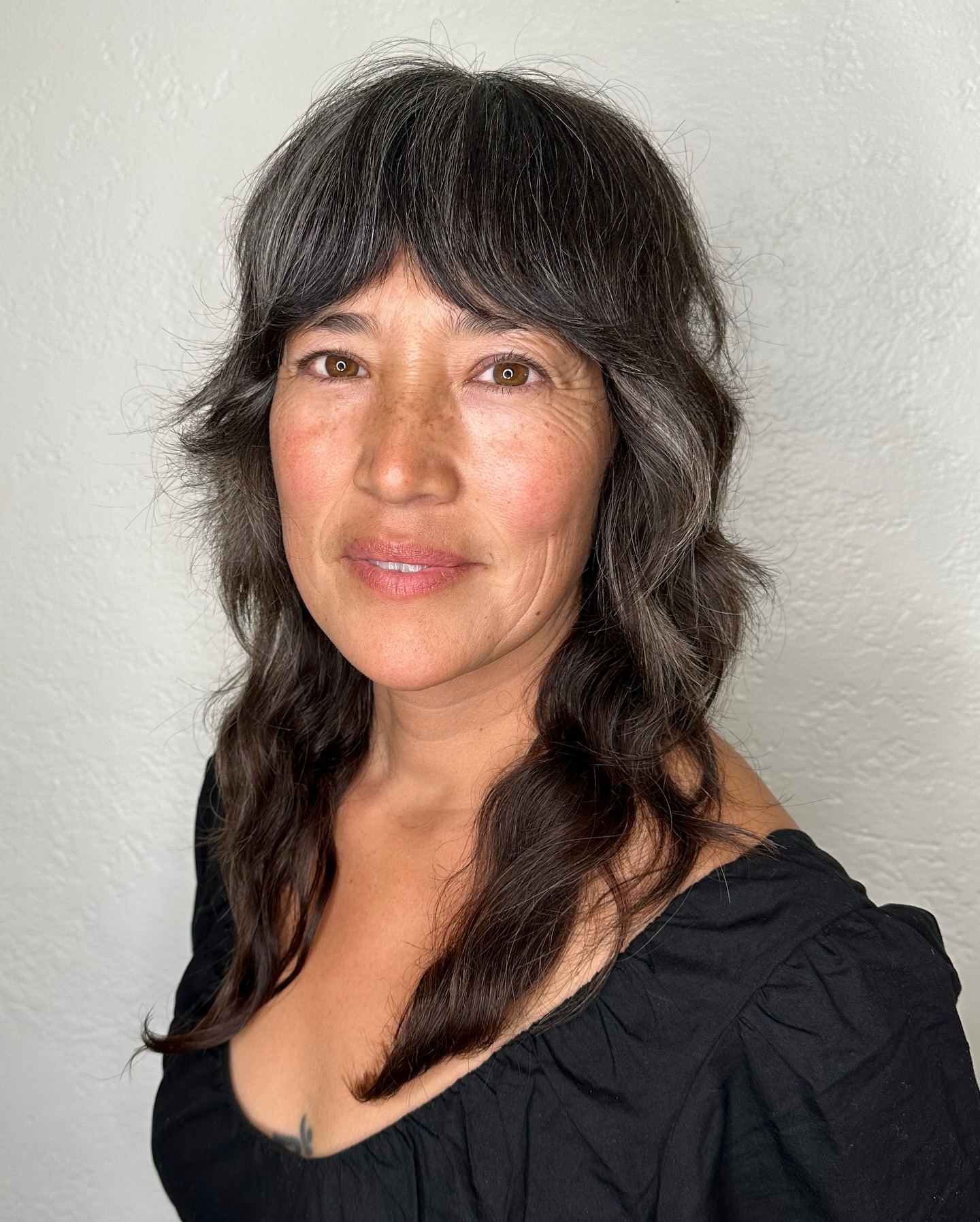 Chic Textured Shag with Soft Wispy Bangs
