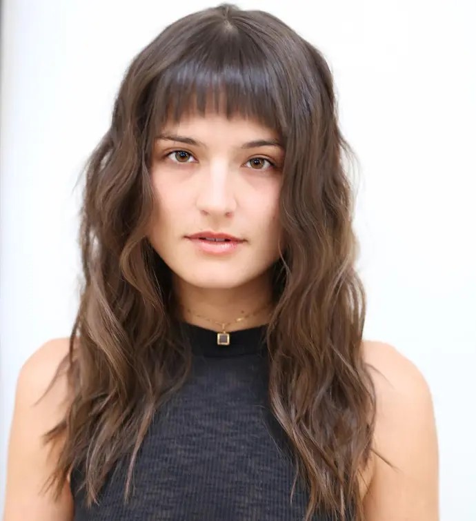 Chic Textured Waves with Bold Fringe Bangs