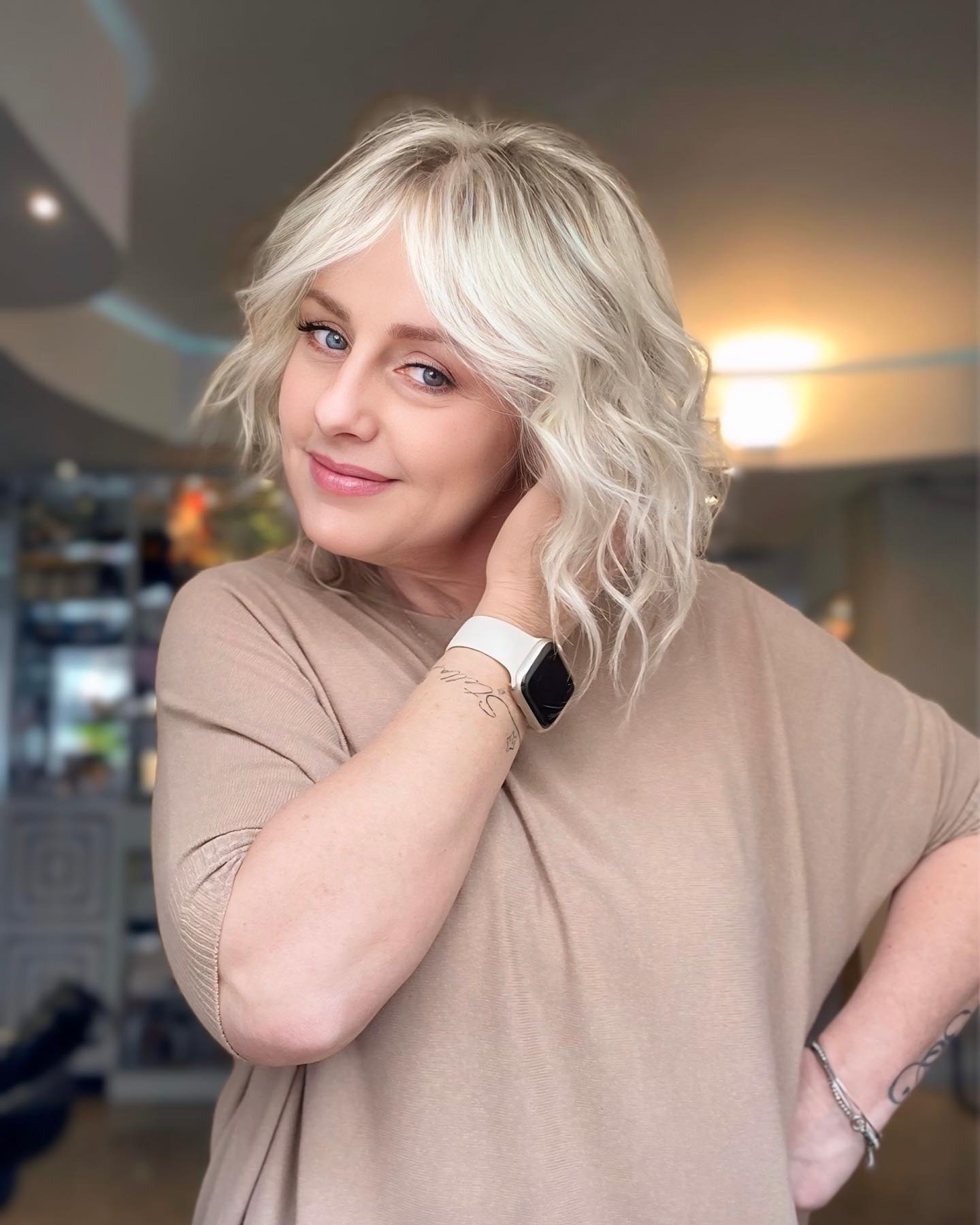 Light Blonde Textured Waves with Soft Bangs